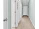 Hallway with carpet, and neutral walls leading to various rooms at 1230 St. George Ln. # F, Myrtle Beach, SC 29588