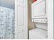 Convenient in-unit stackable washer and dryer, located in the bathroom area at 1230 St. George Ln. # F, Myrtle Beach, SC 29588