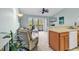Living room featuring a ceiling fan, sliding doors to a balcony, and neutral carpet at 1230 St. George Ln. # F, Myrtle Beach, SC 29588