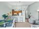 Open concept space with a breakfast bar, table, chairs, and a cozy seating area at 1230 St. George Ln. # F, Myrtle Beach, SC 29588