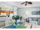 Open concept living space with kitchen, dining table, and comfortable living area with ample lighting at 1230 St. George Ln. # F, Myrtle Beach, SC 29588