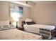 Cozy bedroom with two twin beds, stylish bedding, and a relaxing ambiance at 140 Spanish Oak Ct. # 1, Surfside Beach, SC 29575
