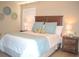 Bedroom with a bed, wooden headboard, shutters, and decorative bedside lamps at 140 Spanish Oak Ct. # 1, Surfside Beach, SC 29575