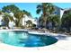 Refreshing community pool with lounge chairs surrounding it, perfect for relaxation at 140 Spanish Oak Ct. # 1, Surfside Beach, SC 29575