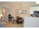 Comfortable dining area featuring a glass-top table, wooden chairs, and open floor plan at 140 Spanish Oak Ct. # 1, Surfside Beach, SC 29575