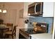 This kitchen features stainless steel appliances, a stylish backsplash, and a dining area adjacent to the cooking area at 140 Spanish Oak Ct. # 1, Surfside Beach, SC 29575