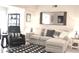 Elegant living room showcasing a plush sofa, designer rug, and stylish decor at 140 Spanish Oak Ct. # 1, Surfside Beach, SC 29575