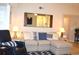 Comfortable living room featuring a plush sectional sofa, hardwood floors and stylish decor at 140 Spanish Oak Ct. # 1, Surfside Beach, SC 29575