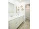 Well-lit bathroom with double sinks, modern fixtures, and decorated with sea turtle accents at 1612 Seachase Way, North Myrtle Beach, SC 29582