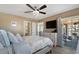 Inviting bedroom with a bed, dresser, TV, balcony access, and stylish beach-themed decor at 212 Landing Rd. # G, North Myrtle Beach, SC 29582