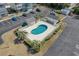 Aerial view of the community swimming pool and surrounding parking area at 212 Landing Rd. # G, North Myrtle Beach, SC 29582