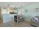 Charming dining area with seating and view into the modern kitchen at 212 Landing Rd. # G, North Myrtle Beach, SC 29582