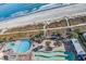 Aerial view of the beach and ocean, with pools, lounge chairs, and palm trees near the hotel at 3000 Ocean Blvd. # 1209, Myrtle Beach, SC 29577