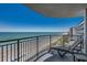 Oceanfront balcony featuring a chaise lounge and panoramic views of the beach at 3000 Ocean Blvd. # 1209, Myrtle Beach, SC 29577