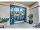 Entrance to The Harbor Gift Shop with glass double doors and greenery flanking the entrance at 3000 Ocean Blvd. # 1209, Myrtle Beach, SC 29577