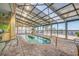 Indoor pool area with glass ceilings and palm trees, providing a relaxing and tropical ambiance at 3000 Ocean Blvd. # 1209, Myrtle Beach, SC 29577