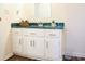 Bathroom vanity featuring white cabinets, green countertop, and chrome fixtures at 3285 Della Rd., Longs, SC 29568