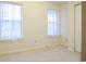 Bright bedroom featuring carpet flooring and two windows with sheer curtains at 3285 Della Rd., Longs, SC 29568