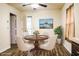 The dining room features updated flooring, neutral walls, and a table with chairs at 3285 Della Rd., Longs, SC 29568