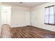 Bright living room with wood floors, closet, and natural light from the window at 3285 Della Rd., Longs, SC 29568