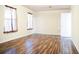 Bright living room showcasing wood floors and natural light from the two windows at 3285 Della Rd., Longs, SC 29568