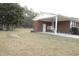 Charming single-story brick home featuring a covered porch and well-kept lawn at 3285 Della Rd., Longs, SC 29568