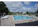 Community pool featuring lounge chairs and clear blue water on a sunny day at 411 Lifestyle Court, Surfside Beach, SC 29575