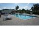 Sparkling community pool with an adjacent pool house and sun loungers at 415 Lifestyle Court, Surfside Beach, SC 29575