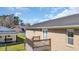 Backyard view of a brick house with a small deck and shed at 4938 Trooper Ln., Loris, SC 29569