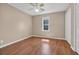 Bedroom with wood floors, window and closet at 4938 Trooper Ln., Loris, SC 29569