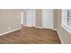 Neutral bedroom with hardwood floors and two closets near a window at 4938 Trooper Ln., Loris, SC 29569