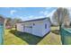 Exterior of a detached garage with a rolling garage door and a black roof at 4938 Trooper Ln., Loris, SC 29569