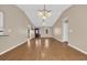 Spacious living room with hardwood floors, high ceilings, and neutral paint at 4938 Trooper Ln., Loris, SC 29569