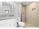 Bathroom with tile shower, granite vanity and mirror at 601 Mitchell Dr. # 203, Myrtle Beach, SC 29577