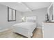 Well-lit bedroom featuring a queen bed with gray walls and a white frame and furnishings at 601 Mitchell Dr. # 203, Myrtle Beach, SC 29577