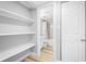 A spacious open closet leading to a full bathroom with tub and shower at 601 Mitchell Dr. # 203, Myrtle Beach, SC 29577