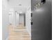 Hallway entry featuring black door, digital lock and gray walls that lead to bedrooms and bathrooms at 601 Mitchell Dr. # 203, Myrtle Beach, SC 29577