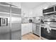 Well-lit kitchen featuring stainless steel appliances, granite countertops and white cabinetry at 601 Mitchell Dr. # 203, Myrtle Beach, SC 29577