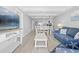 Bright, modern living room and dining area, featuring updated flooring and open concept design at 601 Mitchell Dr. # 203, Myrtle Beach, SC 29577