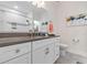 Modern bathroom showcasing a sleek vanity with grey countertop, white cabinets and a decorative tiled shower at 6095 Catalina Dr. # 1314, North Myrtle Beach, SC 29582