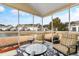 Enclosed porch with seating area overlooking lake and backyard in residential neighborhood at 6095 Catalina Dr. # 1314, North Myrtle Beach, SC 29582