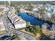 Aerial view of waterfront condos surrounded by trees and next to waterway at 70 Addison Cottage Way # 121 & 32, Murrells Inlet, SC 29576