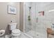 Modern bathroom featuring a glass-enclosed shower with white marble tile and a standard toilet at 70 Addison Cottage Way # 121 & 32, Murrells Inlet, SC 29576