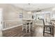 Charming dining area with seating for four, seamlessly connected to the inviting living room and kitchen at 70 Addison Cottage Way # 121 & 32, Murrells Inlet, SC 29576