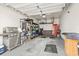Well-organized two-car garage with shelving and epoxy floor at 70 Addison Cottage Way # 121 & 32, Murrells Inlet, SC 29576