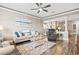 Comfortable living room with a large sofa, recliner, and open access to the kitchen and dining areas at 70 Addison Cottage Way # 121 & 32, Murrells Inlet, SC 29576