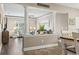 Comfortable living room with stylish decor, seamlessly connected to the dining area for a modern living experience at 70 Addison Cottage Way # 121 & 32, Murrells Inlet, SC 29576