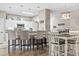 A stylish living space blending the dining area and kitchen with bar stool seating for modern living at 70 Addison Cottage Way # 121 & 32, Murrells Inlet, SC 29576
