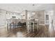 A stylish living space blending the dining area and kitchen with bar stool seating for modern living at 70 Addison Cottage Way # 121 & 32, Murrells Inlet, SC 29576