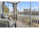 Enjoy the outdoors on this screened porch with views of the serene waterway at 70 Addison Cottage Way # 121 & 32, Murrells Inlet, SC 29576